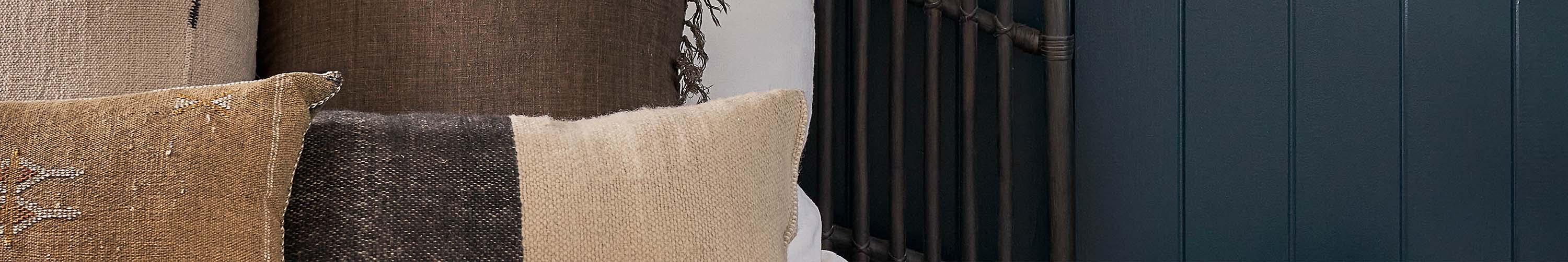 Bed pillow in front of metal bed frame