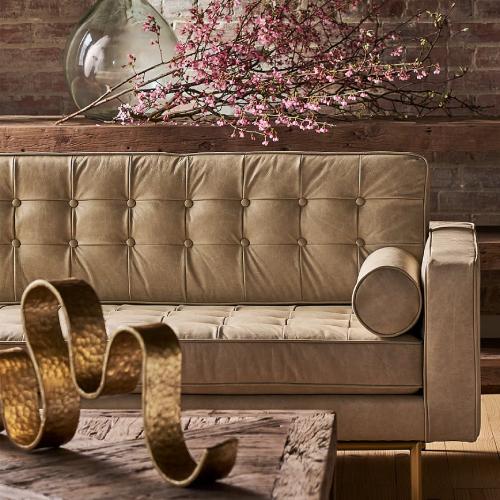 Cream Leather sofa in front of wood coffee table