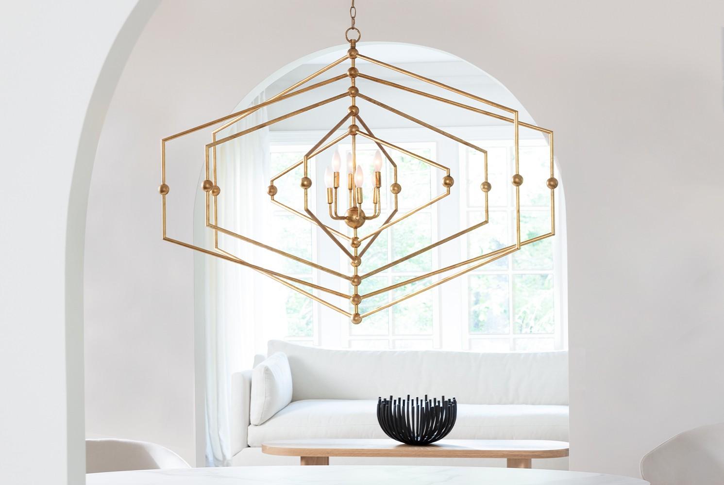White entry hallway with large natural brass modern hexagon chandelier