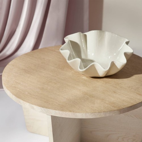 Coffee table with a ceramic ruffle bowl