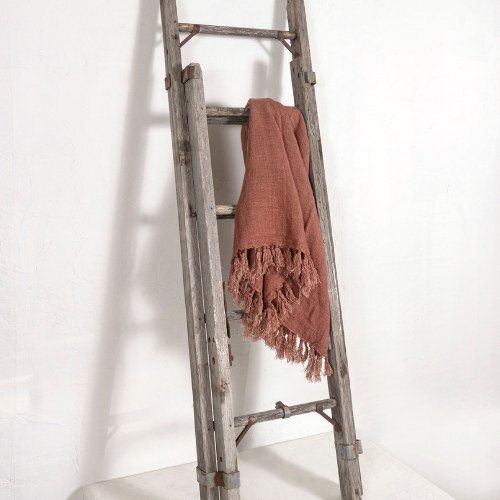 Pink throw blanket on a ladder