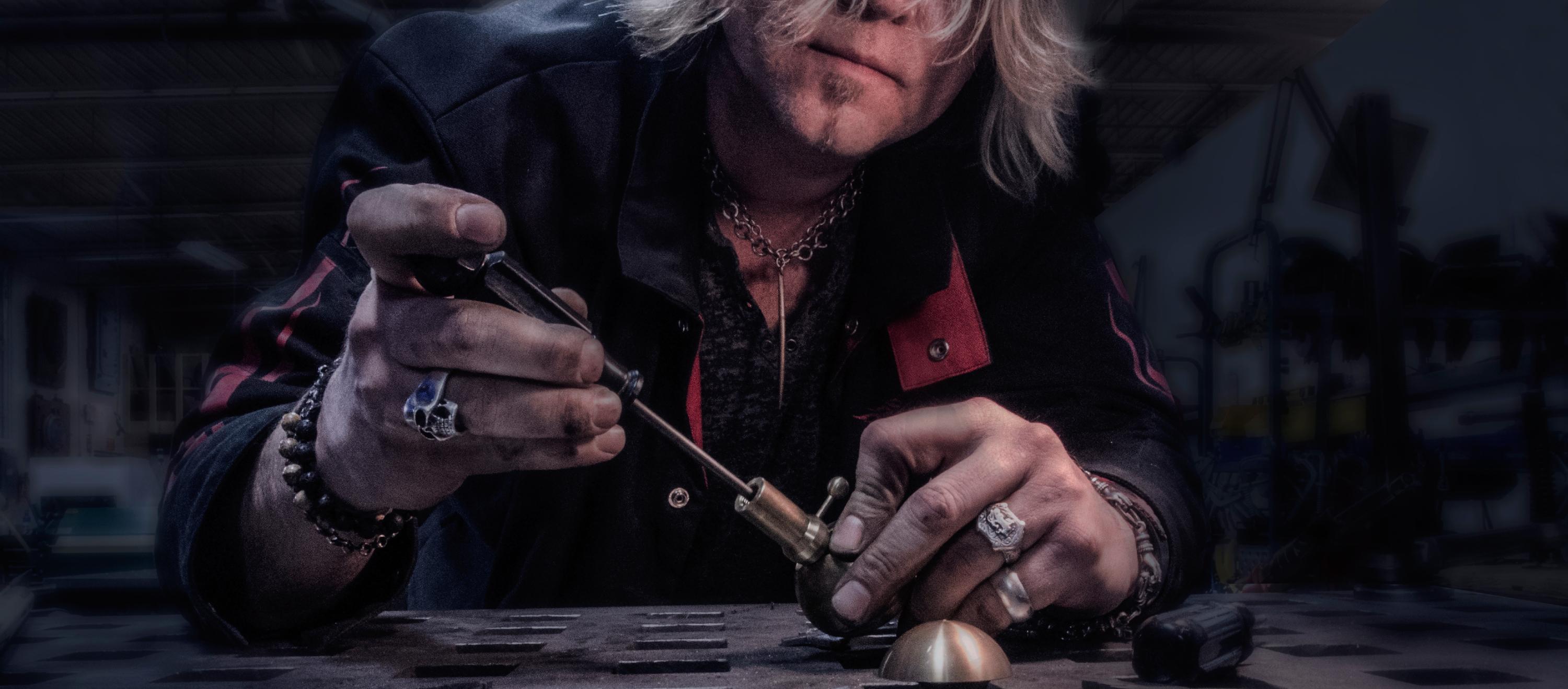 Jimmy of Regina Andrew building a castor on his workbench