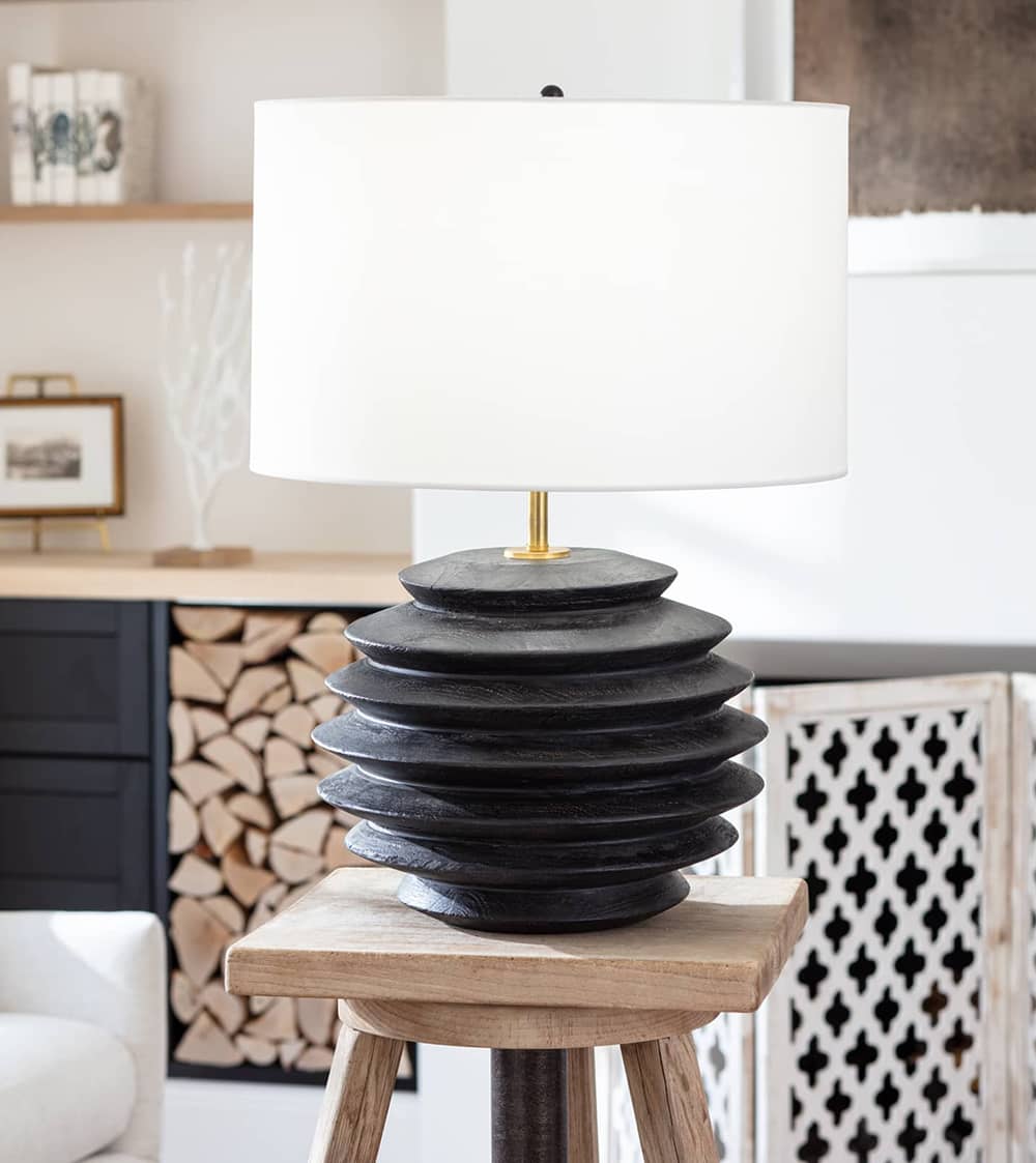 Living room side table with a black modern round lamp with a white shade