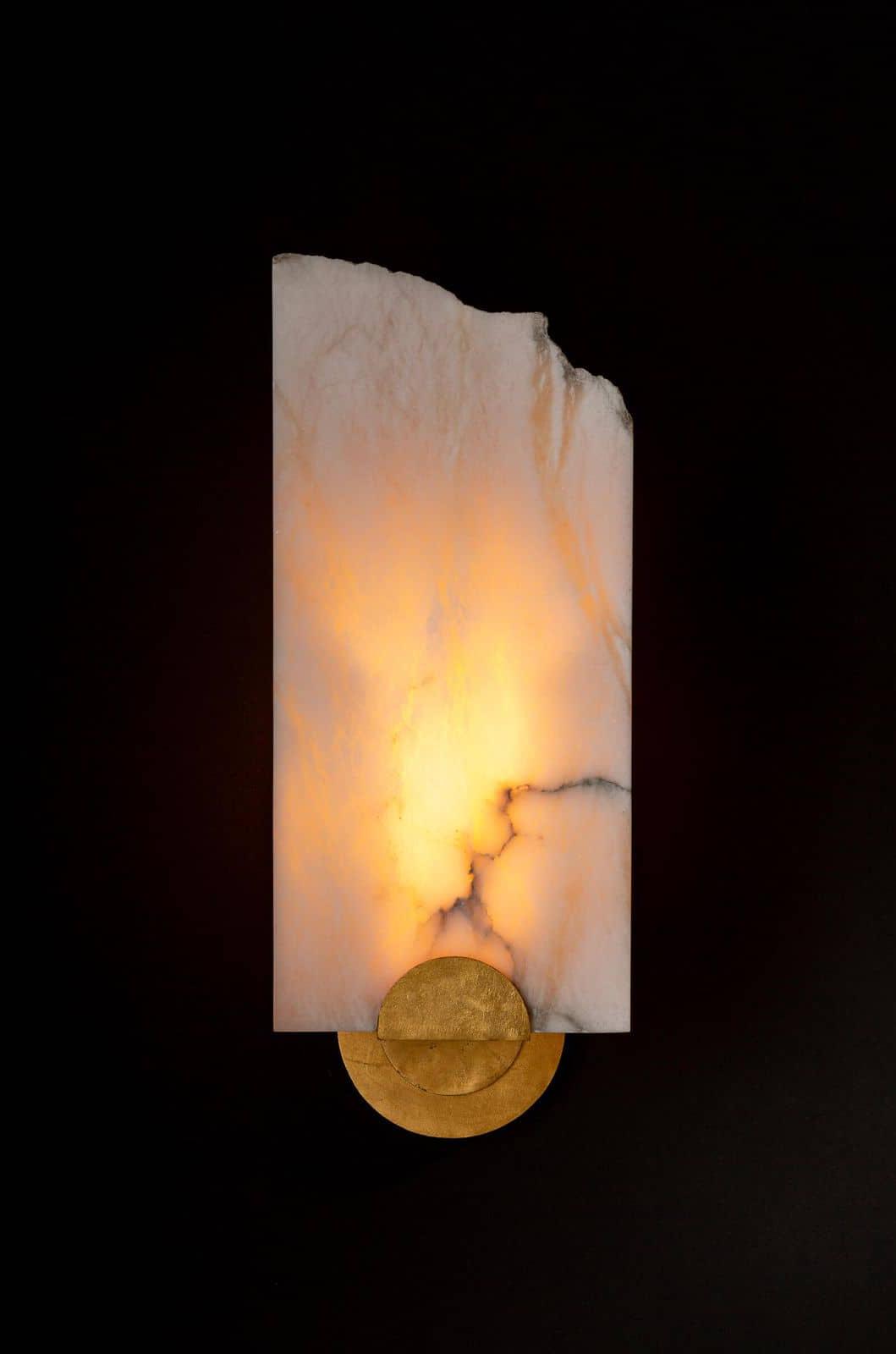 Lit up alabaster sconce with gold accents