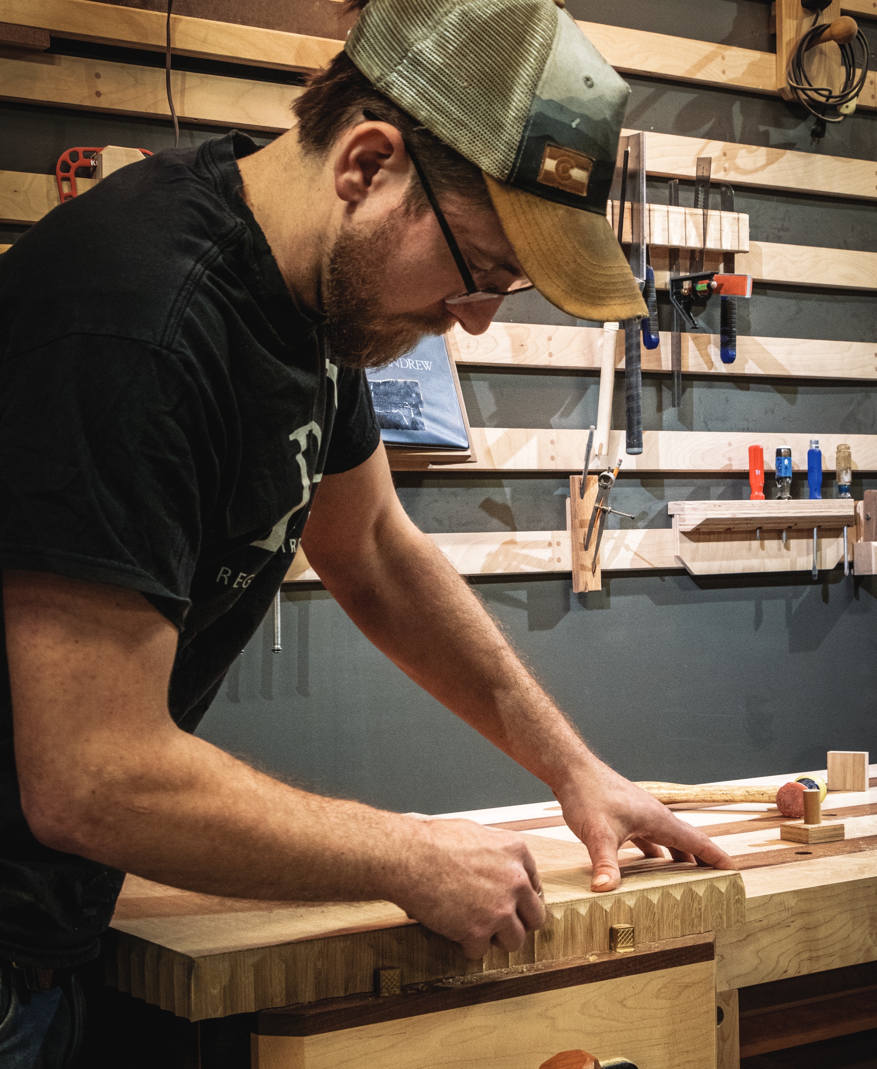 Man planing the wood of a table