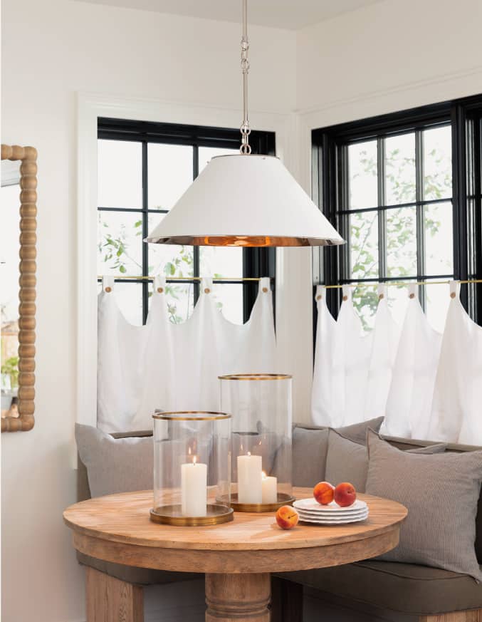 three leather bar chairs next to a kitchen island