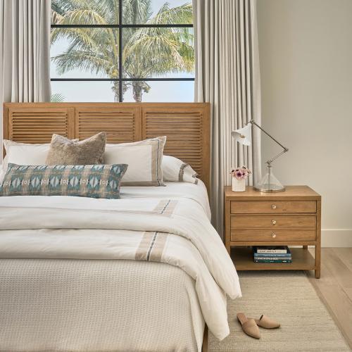 modern coastal bed with wooden nightstand and nickel task lamp