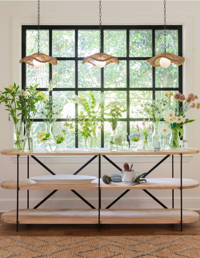 scallop gold mirror over gold console table with marble