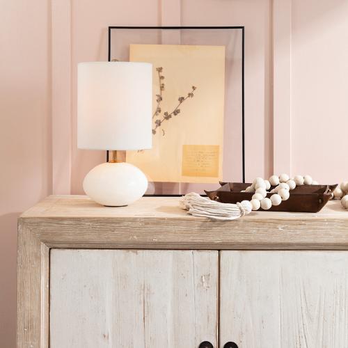 rustic console table with a mini table lamp on top