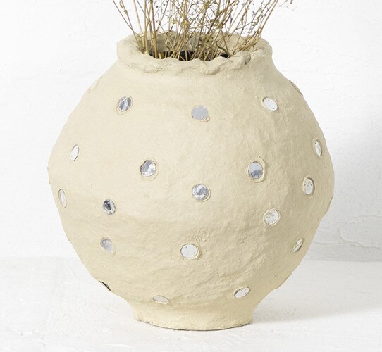 paper mache pot with reflective buttons on the side