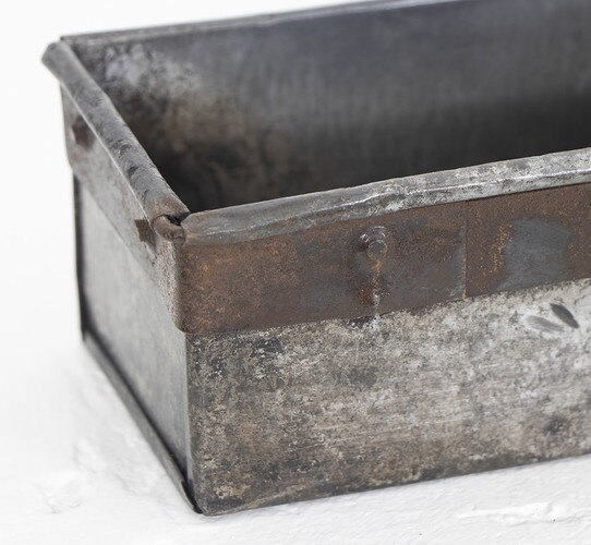 Worn patina of an iron tray