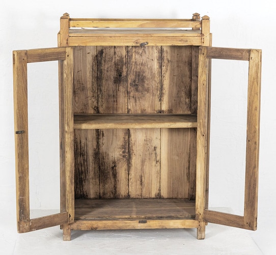 Worn patina of the interior of a teak cabinet