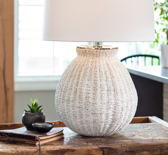 Textured ceramic table lamp on a wooden console table