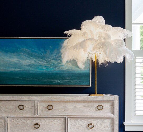 Ostrich feather table lamp with a thin gold lamp