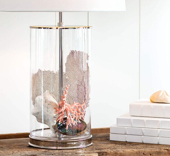 Open glass table lamp with shells, coral and glass on the inside