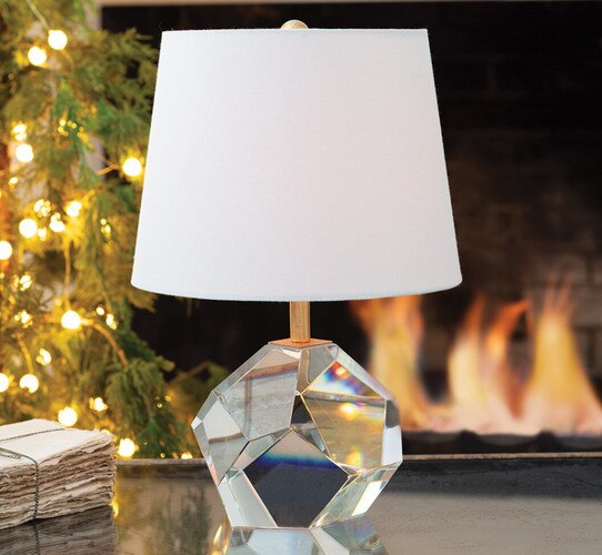 Crystal hexagonal lamp on a zinc coffee table