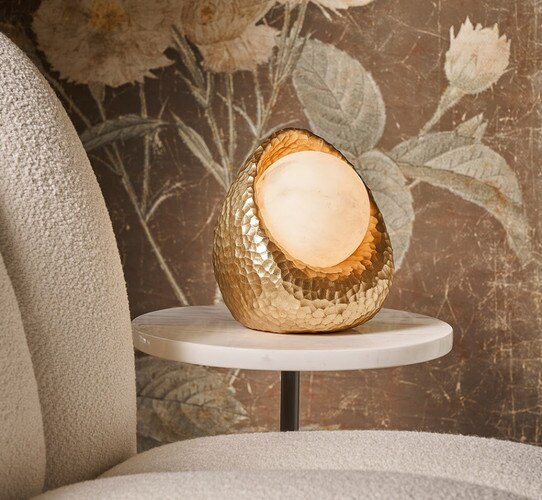 Organic shaped gold mini lamp on a side table