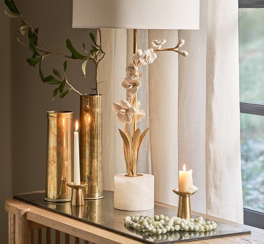 Alabaster base table lamp with a ceramic and gold body of flowers and stems