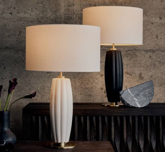 White lamp and black lamp on a black table