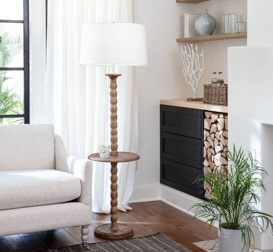 Coastal wood lamp next to sofa in a living room