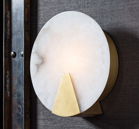 Alabaster circular wall sconce with a gold wedge accent