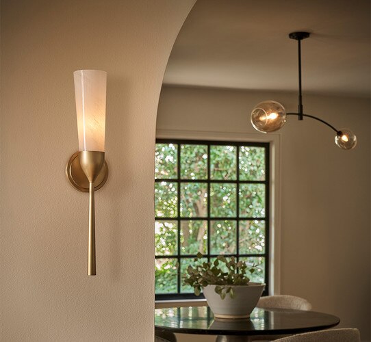 Brass wall sconce with fluted shade