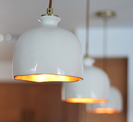 Glossy white ceramic pendants with a gold interior