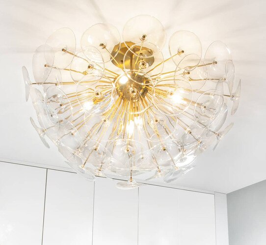 Clear glass and gold semi-flush in the shape of a poppy plant