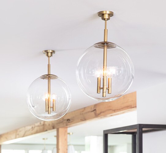 Glass and brass globe chandelier with three brass sockets