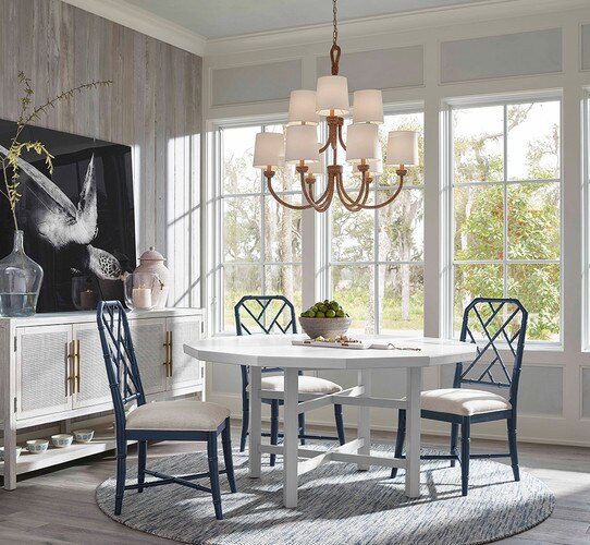 Two-tiered rope chandelier above a white hexagonal dining table