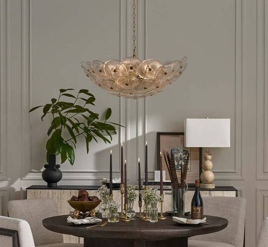Glass and brass chandelier above a dining room table