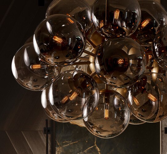 Smole glass bubble chandelier with vintage bulbs illuminated