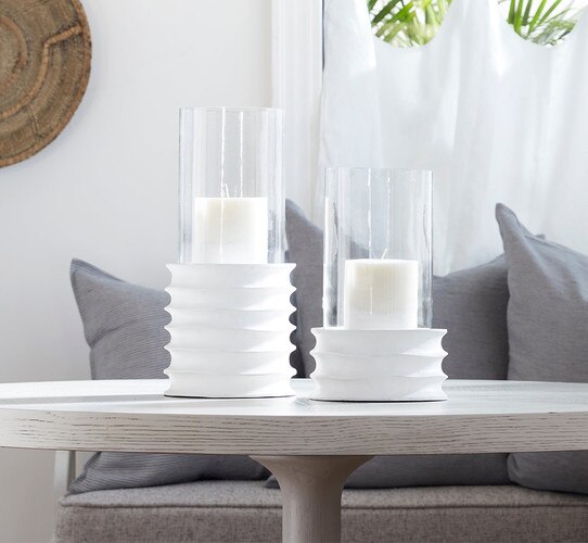 White sculpted hurricane on a white dining room table