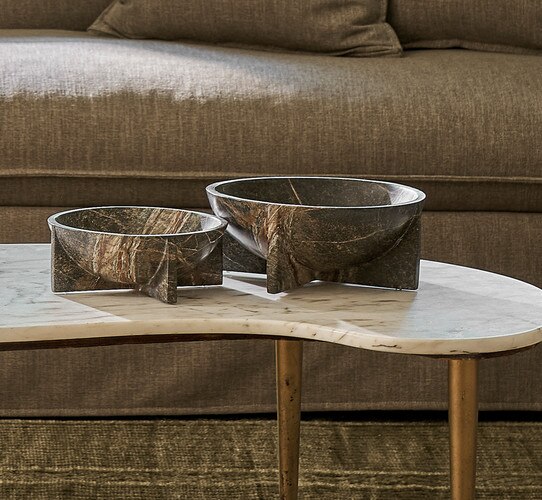 Marble table holding green marble bowls