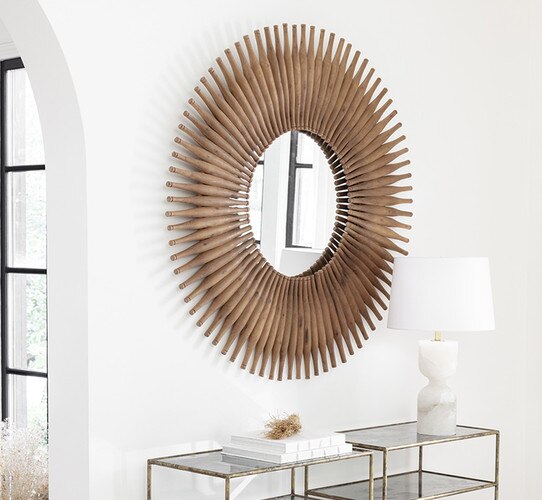 Wood mirror above two small console tables with lamps