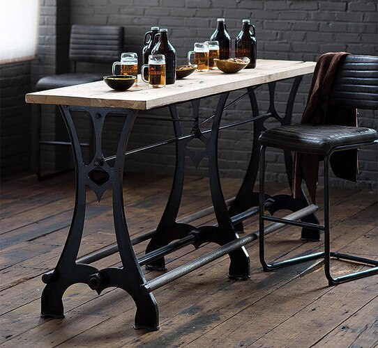 Metal and wood bar table holding beer mugs