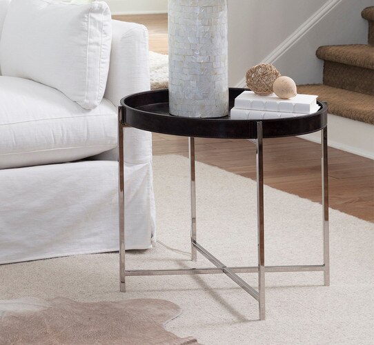 Leather and metal side table beside a white sofa