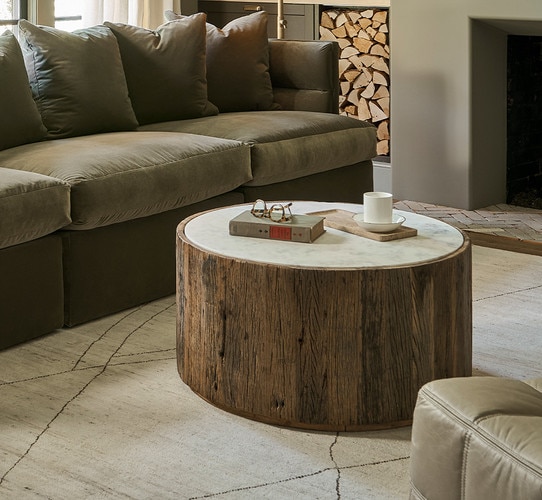 Living room with wood coffee table and green sofa