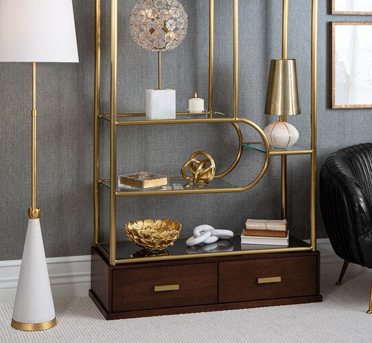 Brass and wood etagere holding lamps and sculptures