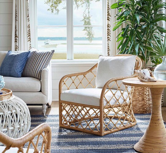 Rattan chair beside a white sofa and rattan side table