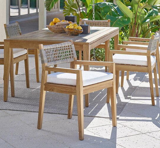 Patio with wood table and wood chairs