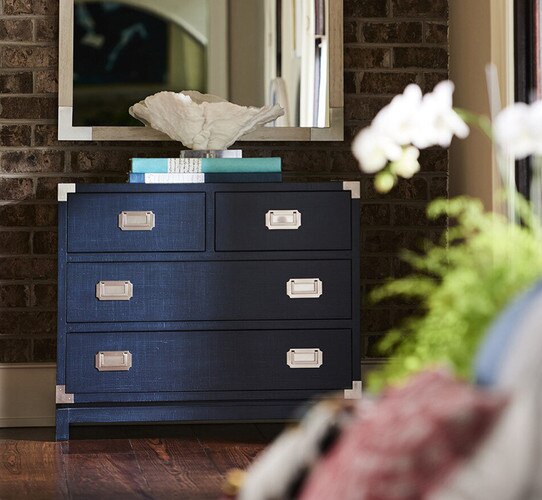 Blue chest with a mirror above it