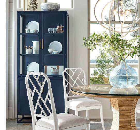Patio dining room with blue etagere and rattan dining table