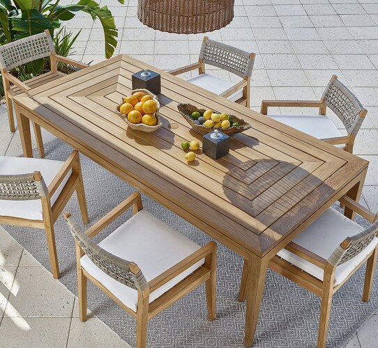 Rectangle wood outdoor table with wood chairs around it