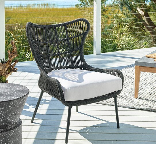 Black wicker chair on a patio