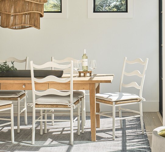 Dining room with wood dining table and white wood chairs
