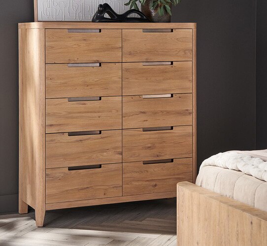 Wood dresser with inlaid metal handles with dÃ©cor and a picture on top