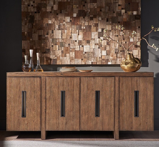 Wood credenza with inlaid etal handles with a large horizontal abstract art piece above it