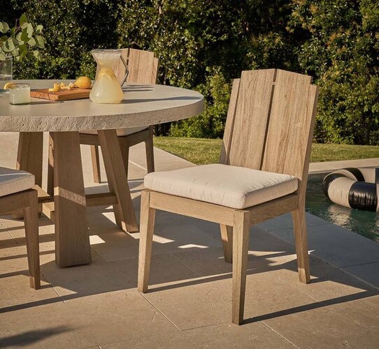 Wood outdoor side chair beside a pitcher of lemonade