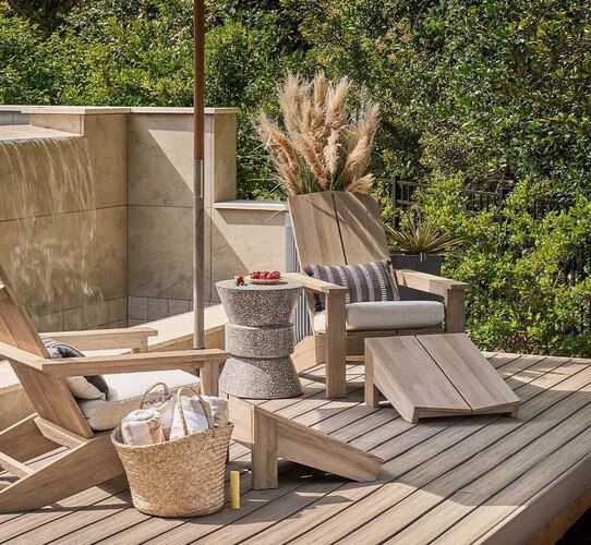 Wood adirondack chair on a wooden deck